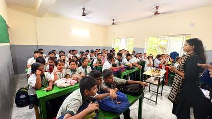 Students watching a robotics demonstration